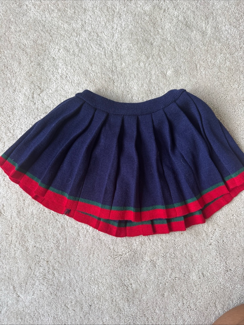 Navy Knit Pleated Skirt with Red and Green Stripe Hem